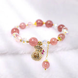 Pulsera positiva con dije de bolsa de dinero de cristal de cuarzo fresa natural Buddha Padmasana