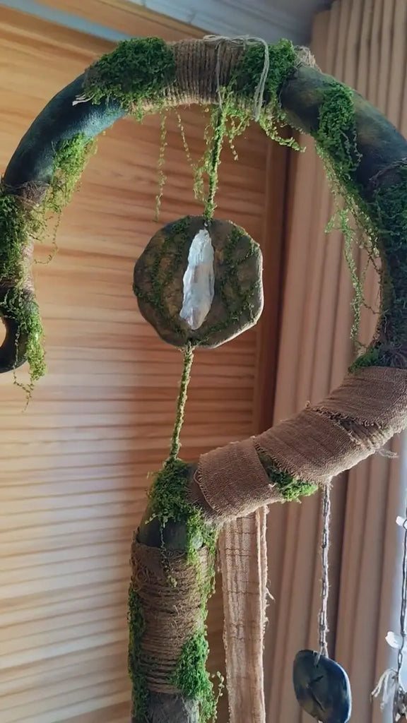 Moss Whisper crystal wand Buddha padmasana