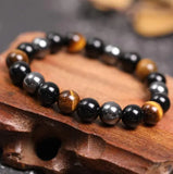 Buddha Padmasana Triple Protection Buddha Bracelet - Tiger’s Eye, Obsidian, Hematite