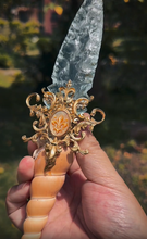 Charger l'image dans la galerie, Hand holding the unique Crystal Ritual Dagger, displaying the full length and ergonomic design of the fossil and glass handle